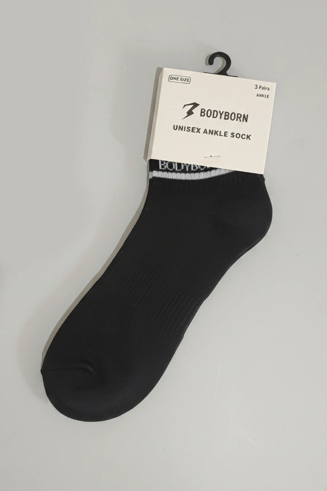 Black ankle sock with 'BODYBORN' packaging on a gray background with a premium feel, soft and comfortable