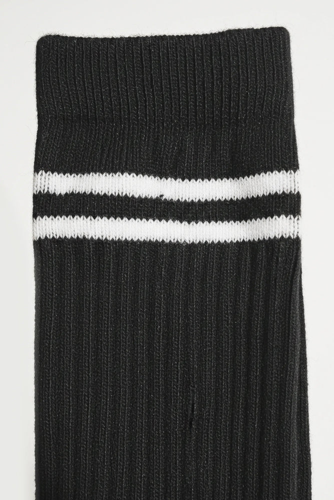 Black sock with two white stripes on a light gray background comfortable and soft