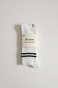 White sock with black stripes on a white background Bodyborn brand in crew size soft and comfortable