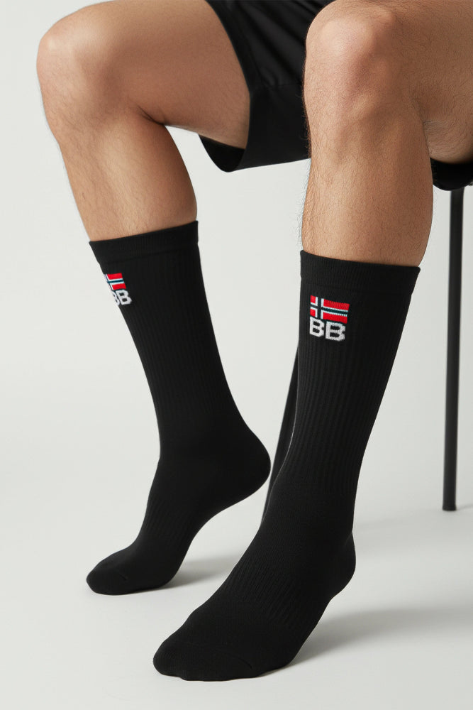 Black socks with a bodyborn logo on a light gray background soft and comfortable