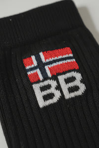 Black sock with embroidered bodyborn logo featuring red, white, and blue colors on a light gray background soft and comfortable