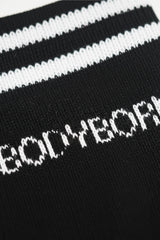 Black and white striped sock with 'BODYBORN' text in crew size comfortable and soft