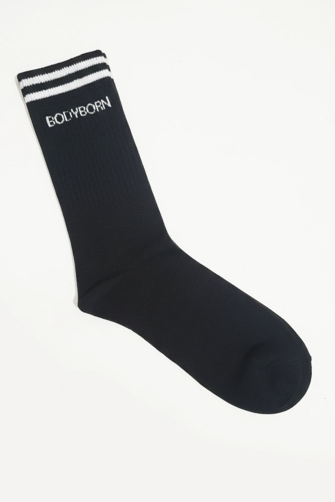 Black sock with white stripes and 'BODYBORN' branding on a white background in crew size comfortable and soft