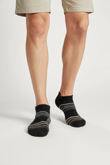 Bodyborn Black low cut socks with colorful stripes worn by a person on a light gray background