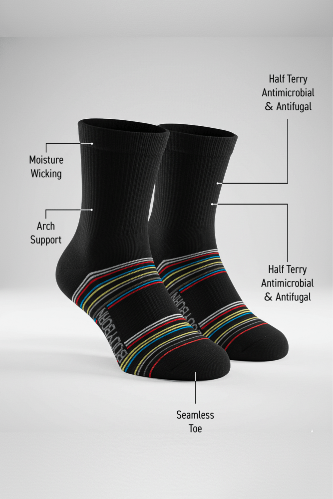 Bodyborn black socks with colorful stripes on a white background, featuring text labels about sock features in a low cut size