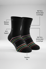 Bodyborn black socks with colorful stripes on a white background, featuring text labels about sock features in a low cut size