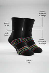 Bodyborn black socks with colorful stripes on a white background, featuring text labels about sock features in a low cut size