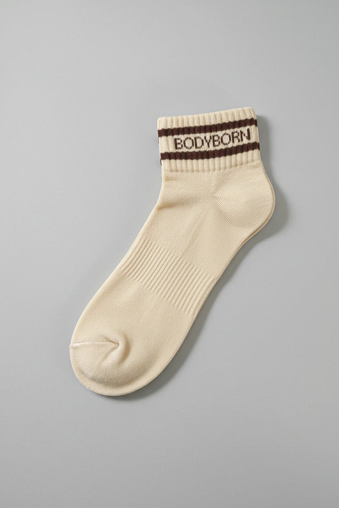 Beige sock with brown striped band featuring 'BODYBORN' on a gray background with premium feel, soft and comfortable