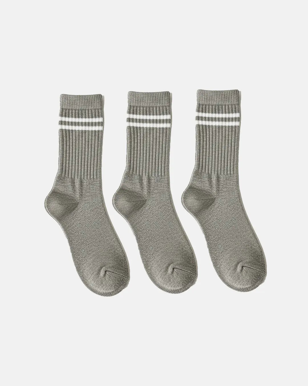 Three grey crew-length socks with ribbed texture and white double-stripe design, arranged in a row on a clean white background