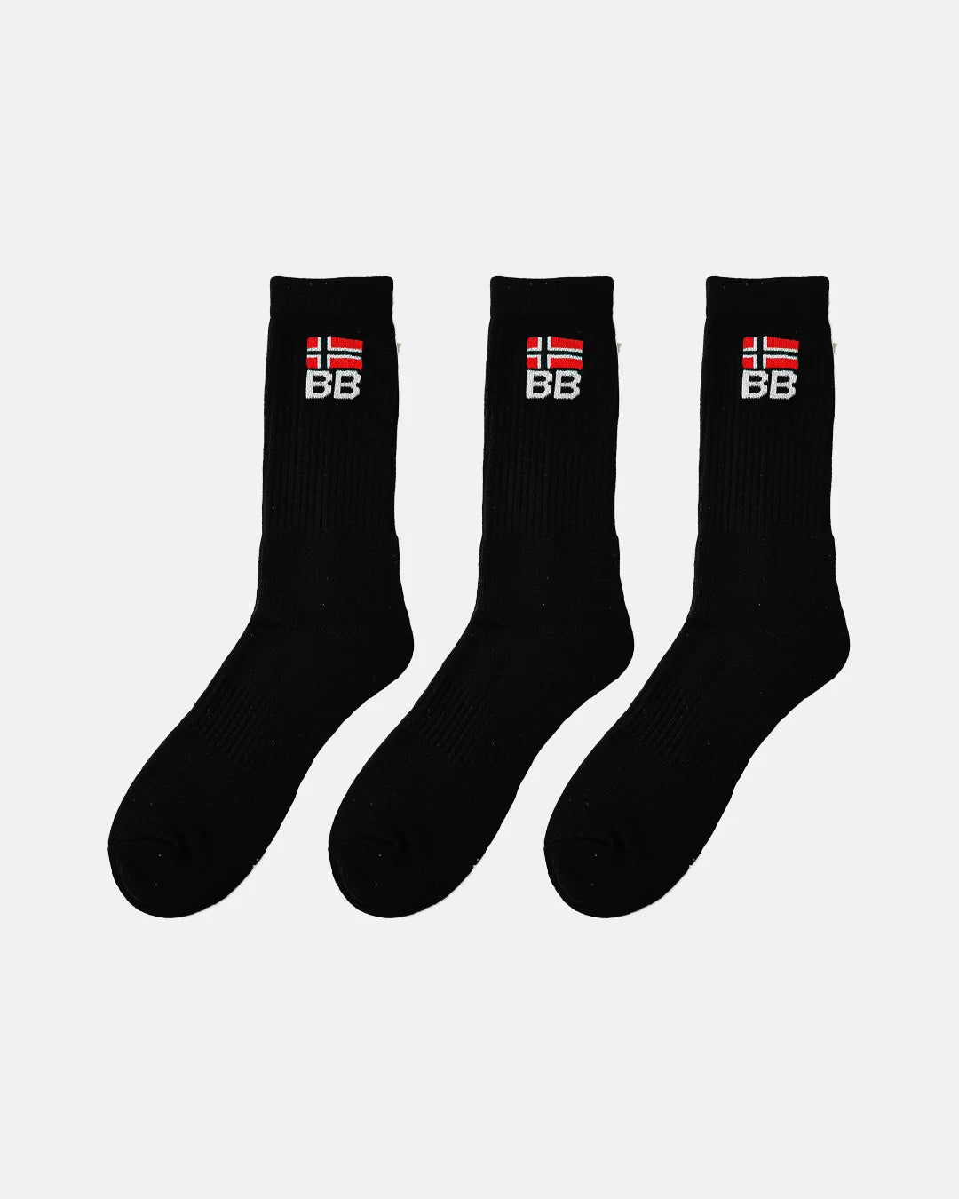 Three black crew-length socks arranged in a row on a white background, each featuring ribbed texture and embroidered BB branding with a red and white flag design