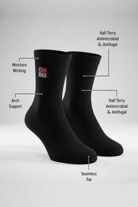 Two black BODYBORN crew-length socks with embroidered flag and BB logo, displayed upright and labeled with features such as moisture-wicking material, arch support, antimicrobial and antifungal half-terry construction, all-over cushioning through the foot and leg, and seamless toe