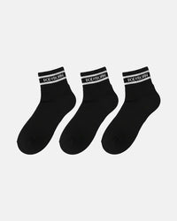 Three black ankle socks arranged in a row on a white background, each designed with ribbed texture and a white BODYBORN branded stripe around the cuff