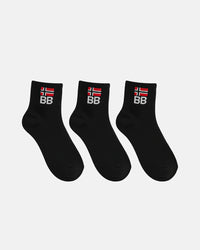 Three black crew-length socks arranged in a row on a white background, each displaying ribbed fabric and a BB logo embroidered beneath a red and white flag symbol