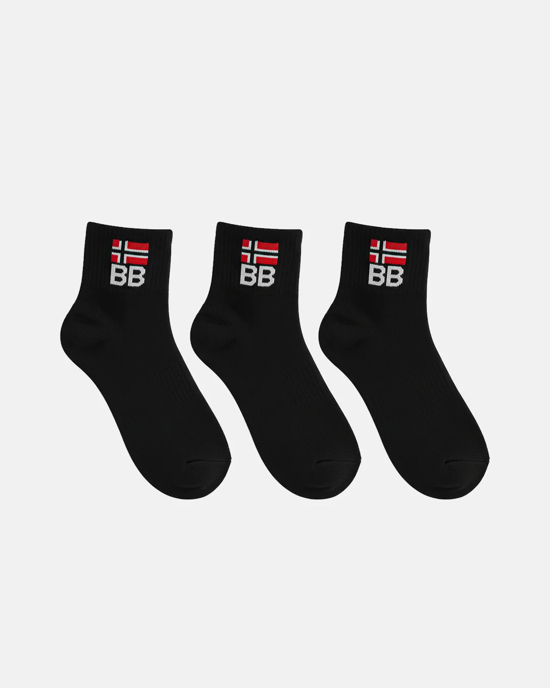 Three black crew-length socks arranged in a row on a white background, each displaying ribbed fabric and a BB logo embroidered beneath a red and white flag symbol
